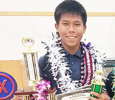 Victor Chen with math competition medals and certificates