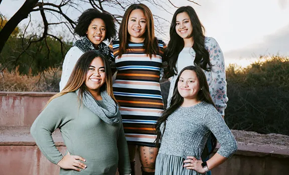 Toalepai pictured with her daughters.