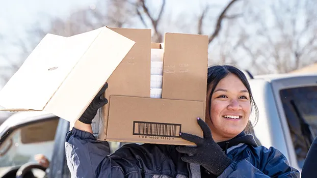 Woman with box of food.