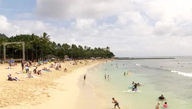 Waikiki Beach with sun bathers and swimmers