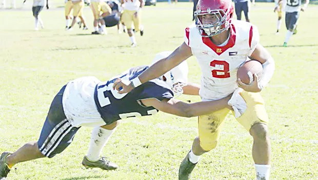  John Allen (2) of the Tafuna Warriors beating the last Samoana Sharks defender at the sidelines