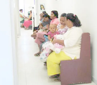 Mothers and babies wait at clinic