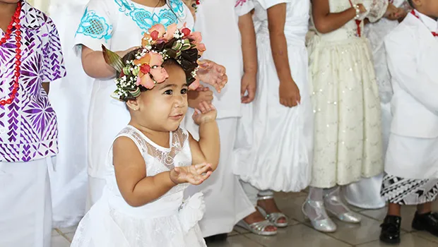 Little girl in her White Sunday best.