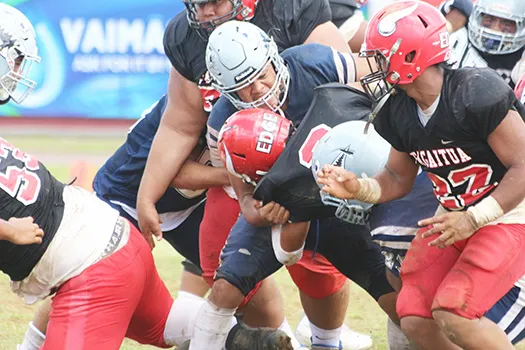 Samoana Sharks defensive captain, Masaichi Aviu breaks to the backfield and sacks Fitu Amata