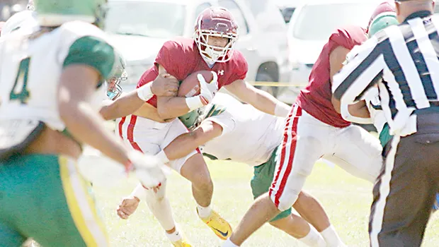 Chris Su’a (2) weaving his way through the heart of Leone’s defense