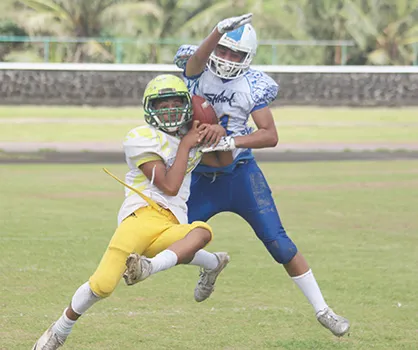 A Leone Lions receiver tries to gain control of the ball while defending was Prodieus Lutu-Fuga of the Sharks
