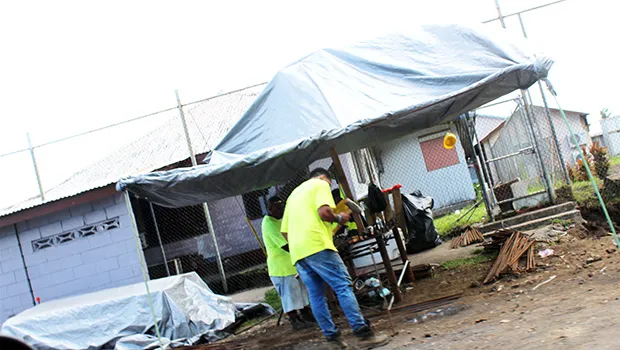 Construction workers seen last Friday afternoon, working on erecting a perimeter wall at the Territorial Correctional Facility.