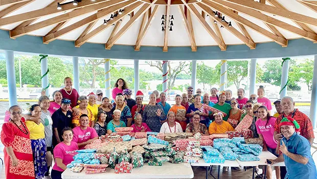 Members of the Rotaract Club with their wrapped gifts