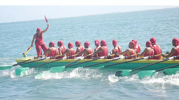 Zita Martel captaining her longboat inside the reef in Samoa.